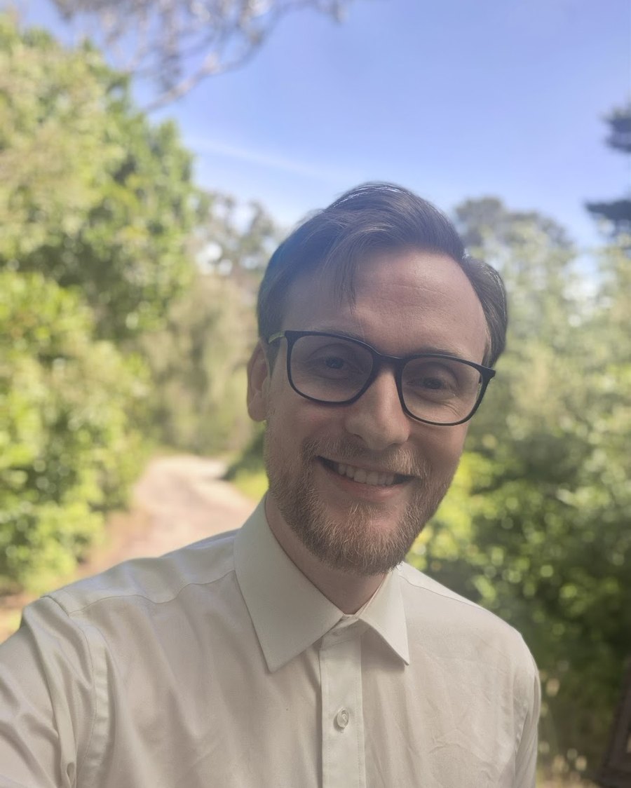 Seb Howell from Extra Desk Business Support smiling outdoors